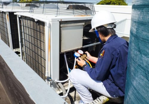 Technician is checking air conditioner