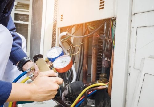 Technician is checking air conditioner